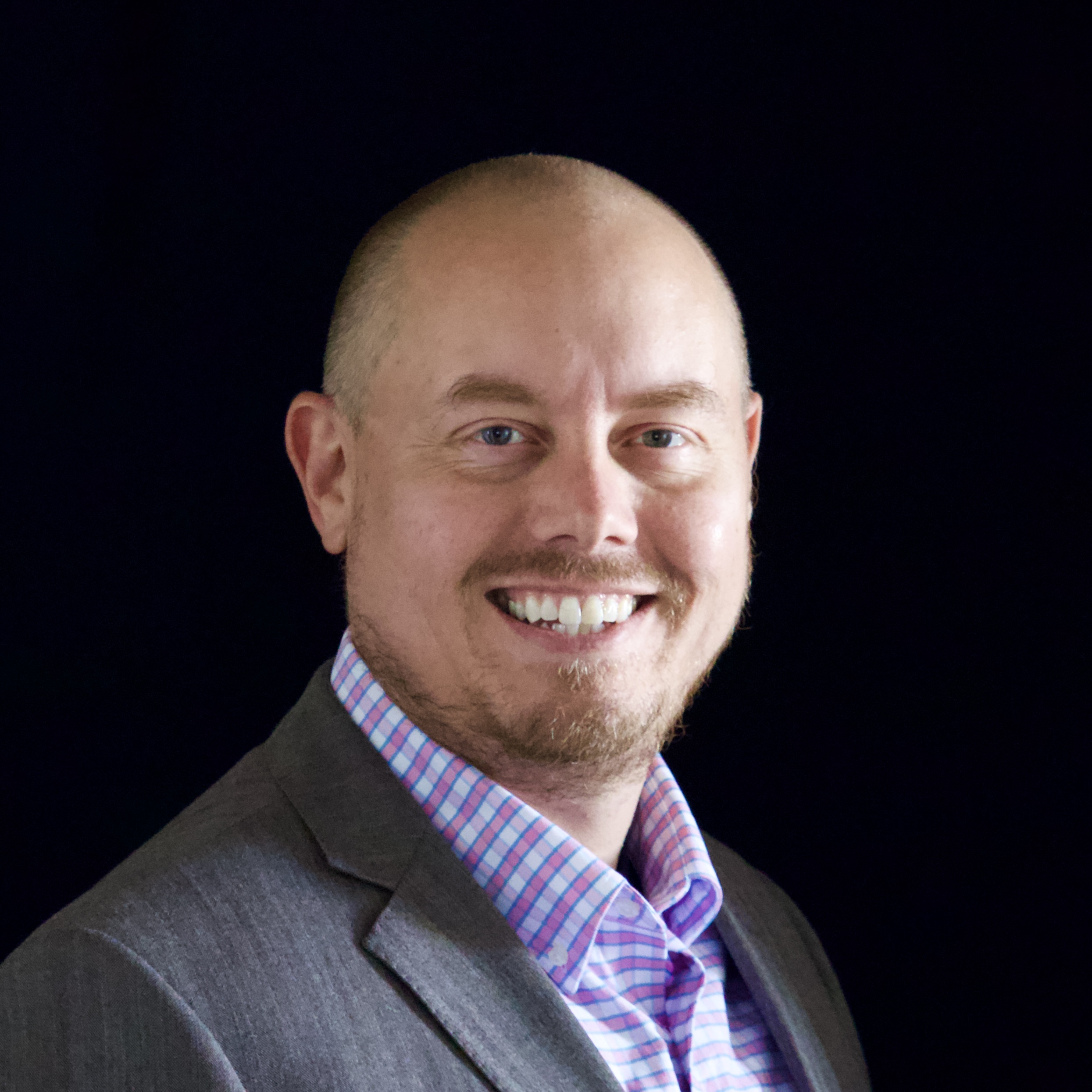 Professional headshot of a licensed psychodynamic therapist offering telehealth services in Nevada